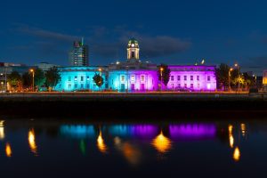 Leinster House lit up in teal and purple